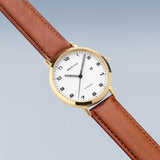 BERING Titanium Polished/Brushed Gold 34mm White Dial Women's Watch 18634-534
